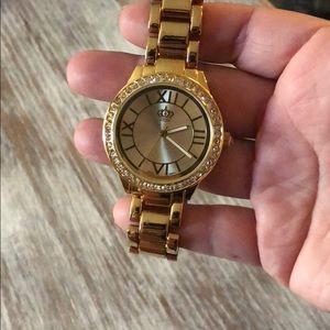 Gold watch with stainless steel back